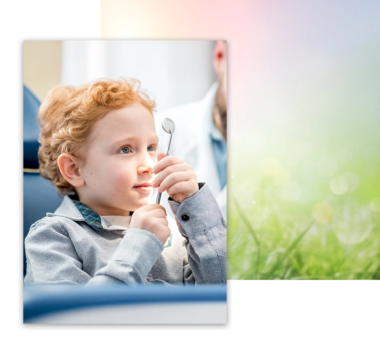 Pediatric Dentist Los Gatos CA Child With Red Hair Examining Dental Mirror Child With Red Hair Examining Dental Mirror